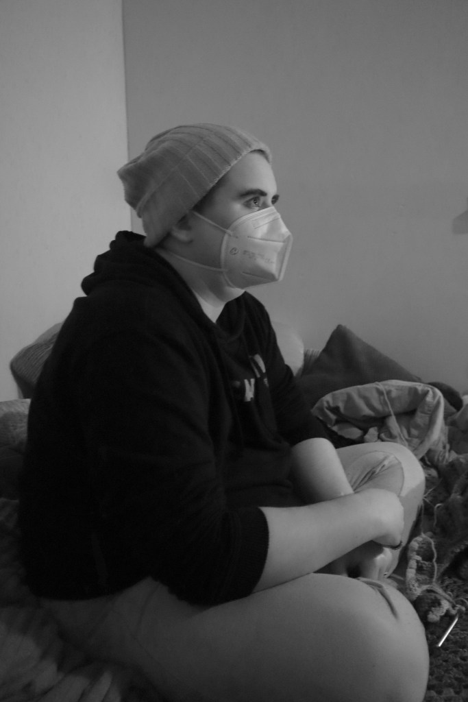 A black and white photo of aspen from the side, looking forward.v